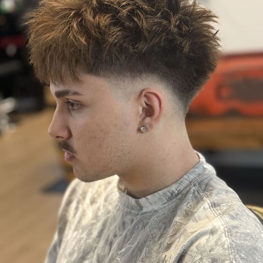 Skin fade with textured top, cut at K8 Fades